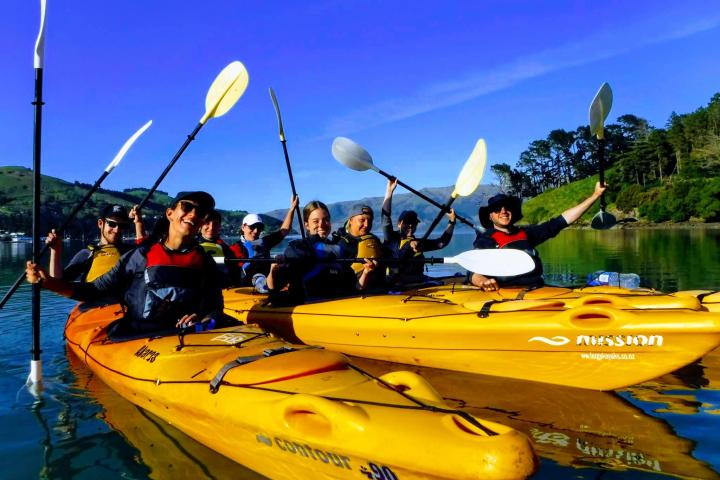 a group of people on a boat in the water